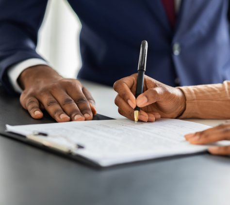 Contract Signing. Female Customer Sign Papers In Dealership Office, Unrecognizable African American Woman Client Buying New Car Or Purchasing Property, Closeup Shot, Cropped Image With Free Space